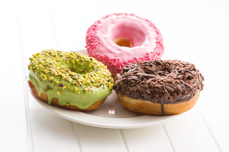 111512256-three-sweet-donuts-on-plate-.jpg